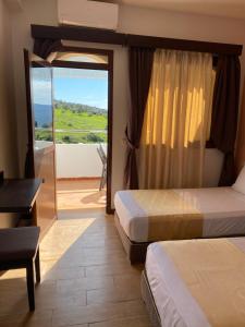 Postel nebo postele na pokoji v ubytování Hotel Chaouen