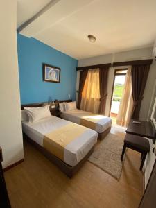 Postel nebo postele na pokoji v ubytování Hotel Chaouen