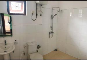 a bathroom with a shower and a toilet and a sink at Ella viewpoint sunnyview in Ella +41 photos