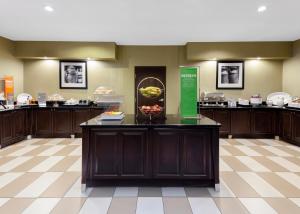 a lobby with a counter with a bowl of fruit on it at Hampton Inn & Suites Hobbs in Hobbs
