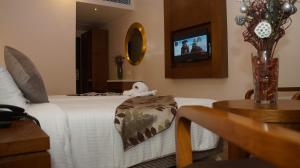 TV a/nebo společenská místnost v ubytování Kani Residency Hotel
