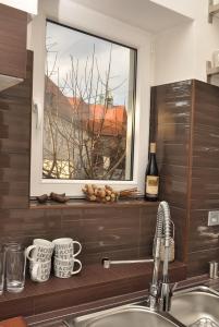 
a bathroom with a sink and a mirror at Luxury Apartment Novobranska in Brno
