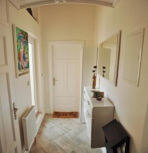 
a room with a white door and white walls at Luxury Apartment Novobranska in Brno
