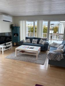 a living room with a couch and a coffee table at Stuga i Gnisvärd in Tofta