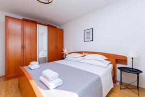 Posteľ alebo postele v izbe v ubytovaní Apartments Marijo
