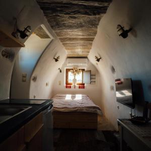 a bedroom with a bed in the middle of a room at Mitatos "Matthew" in Moutsoúna