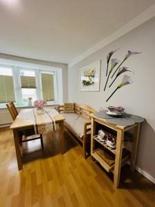 a living room with a couch and a table at Elvis Family Dream in Lübeck +30 photos