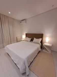 Katil atau katil-katil dalam bilik di Calme S1 avec Jardin dans un Hotel