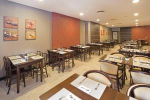 ห้องอาหารหรือที่รับประทานอาหารของ Swan Caxias do Sul
