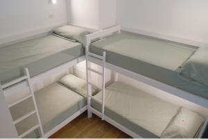 Postel nebo postele na pokoji v ubytování Aiora Hostel