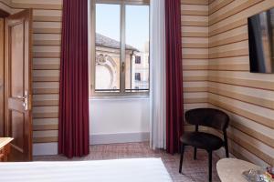 Postel nebo postele na pokoji v ubytování Hotel Mascagni