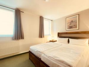 Postel nebo postele na pokoji v ubytování Bungalows am Buchenkampweg