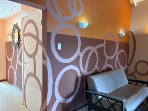 a room with a bench in front of a wall at Centrally located spacious apartment in Willemstad +21 photos