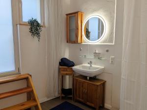 a bathroom with a sink and a mirror at Gästehaus Zeller Altstadt in Zell an der Mosel +59 photos