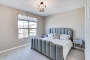 a bedroom with a large bed and a window at Maricopa Home with Yard - 1 Mi to Harrahs Casino! in Maricopa