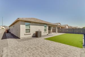 a house with a green lawn in front of it at Maricopa Home with Yard - 1 Mi to Harrahs Casino! in Maricopa