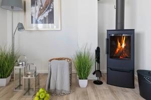 Fotografie z fotogalerie ubytování BeachTerraceFour- EG, Meerblick, Terrasse, Kamin, Sauna v destinaci Olpenitz