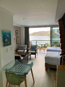 En eller flere senge i et værelse på Espectacular vista a la playa el Rodadero