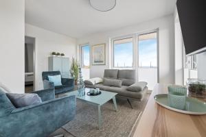 Posezení v ubytování BeachTerraceFour- EG, Meerblick, Terrasse, Kamin, Sauna