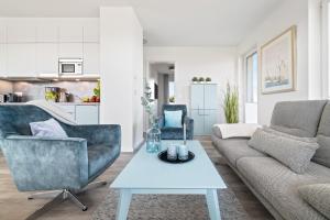Posezení v ubytování BeachTerraceFour- EG, Meerblick, Terrasse, Kamin, Sauna