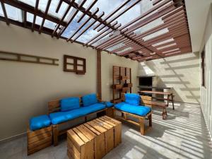 a living room with a couch and chairs and a table at Luxury Villa with Jacuzzi 4 Bedroom 4 Bath in Baños