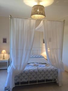 A bed or beds in a room at Tenuta Saracone