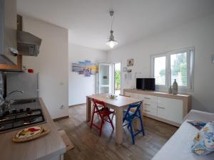 Kuchyň nebo kuchyňský kout v ubytování Casa Luri Porto Cesareo NordSudCasaVacanza