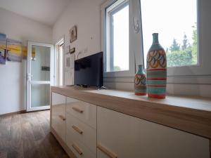 TV a/nebo společenská místnost v ubytování Casa Luri Porto Cesareo NordSudCasaVacanza + 51 fotografií