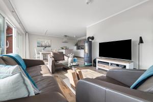 TV a/nebo společenská místnost v ubytování Ferienwohnung Hafenkino