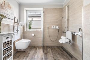 Koupelna v ubytování Ferienwohnung Hafenkino + 28 fotografií