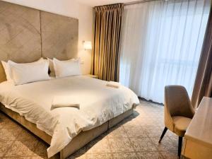 Postel nebo postele na pokoji v ubytování Hotel Arcade