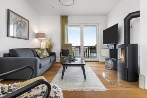 TV a/nebo společenská místnost v ubytování Ocean Harbour- 2 OG, Balkon, Kamin