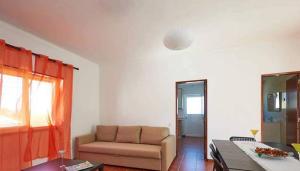 a living room with a couch and a chair at Ericeira Dream Stay in Ericeira +5 photos