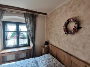 Posteľ alebo postele v izbe v ubytovaní Apartmány U Koudelníka