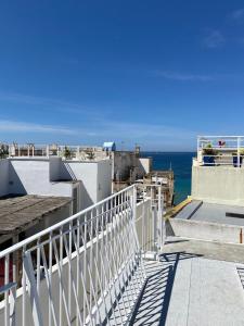 a view of the ocean from the balcony of a building at Casa Manù in Gallipoli