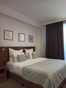 Voodi või voodid majutusasutuse AuRoom Bakuriani Resort toas