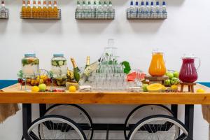 a table with a bunch of drinks on it at Aparthotel Ona Palamós in Palamós