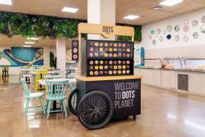 a food stand with a bike on it in a restaurant at Aparthotel Ona Palamós in Palamós