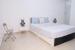 Postel nebo postele na pokoji v ubytování J Martins ApartHotel