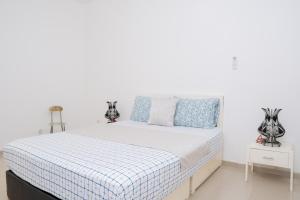 Postel nebo postele na pokoji v ubytování J Martins ApartHotel