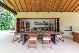 a large wooden table and chairs in a kitchen at Astonishing 5BR House with pool in Anapoima in Anapoima