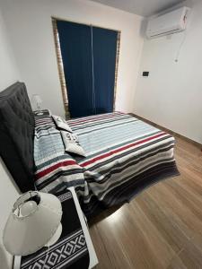 Ein Bett oder Betten in einem Zimmer der Unterkunft Alojamiento Itati + 6 Fotos