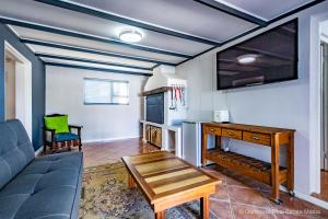 a living room with a couch and a table at Genoeg in Langebaan