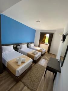 Postel nebo postele na pokoji v ubytování Hotel Chaouen