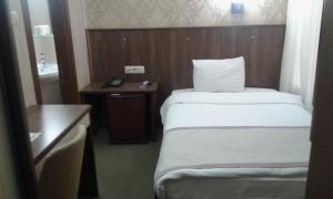 Postel nebo postele na pokoji v ubytování Hosta Otel