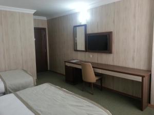 TV a/nebo společenská místnost v ubytování Hosta Otel