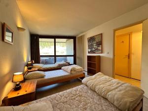 Posteľ alebo postele v izbe v ubytovaní Appartement au Pied des Pistes à Villard-de-Lans, 3 Pièces, 7 Pers., 64m², Balcon Sud - FR-1-515-128