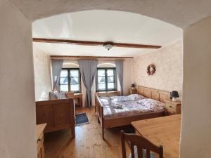 Posteľ alebo postele v izbe v ubytovaní Apartmány U Koudelníka