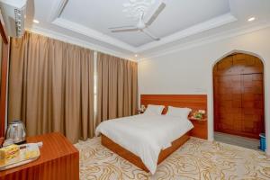 Postel nebo postele na pokoji v ubytování Bait AL-Afiah Apartments