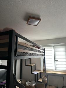 a bedroom with a bunk bed with a light on the ceiling at Villa Milhaud de luxe in Milhaud